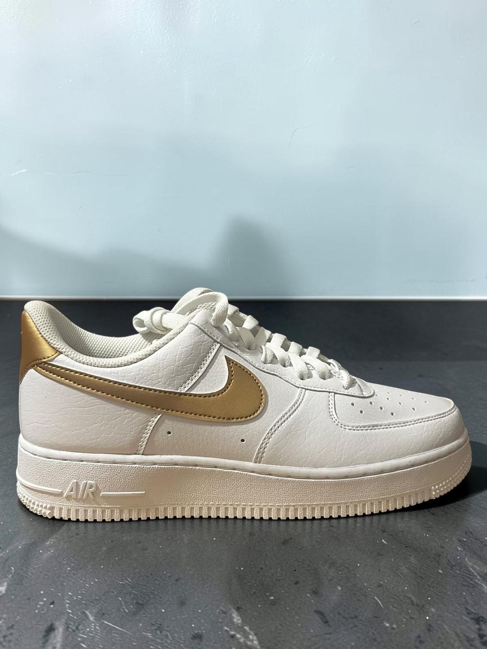 Nike Leather Low-Top Sneaker - White with Gold Swoosh